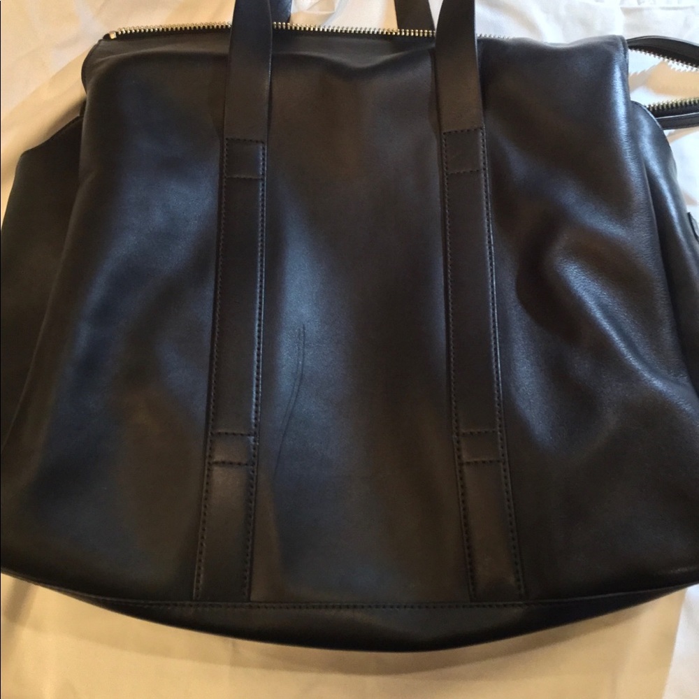 Aritzia’s Six Eleven black leather McDuffle - Picture 6 of 14